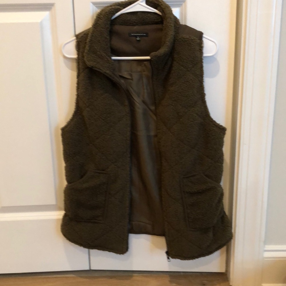 Size small Fleece vest.  Color is a brownish dark green